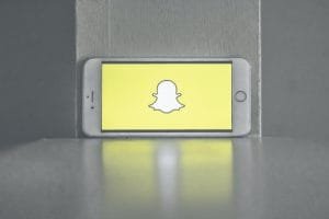 iphone with snapshot logo on screen