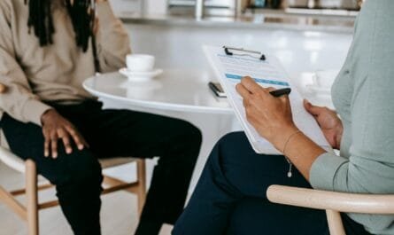 crop faceless multiethnic interviewer and job seeker going through interview