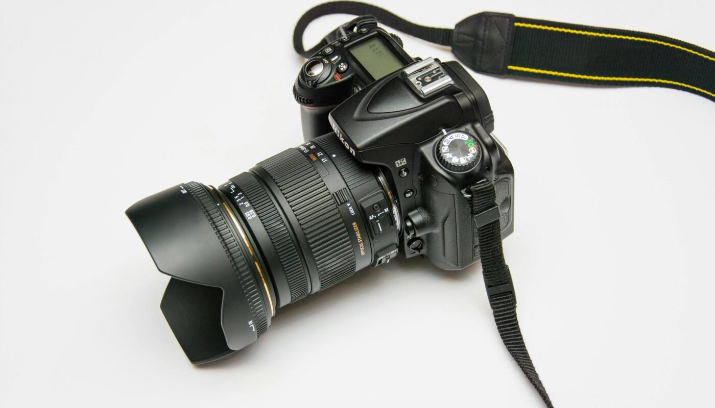 Black dslr camera on white surface